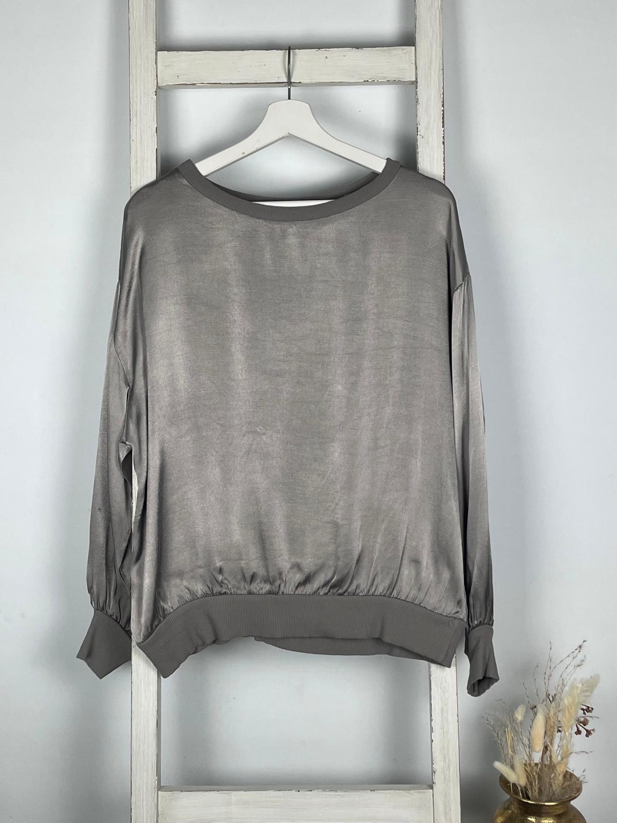 Glänzende Bluse mit Rippsaum